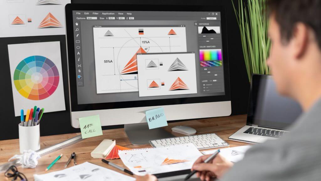 Man designing a logo on computer software