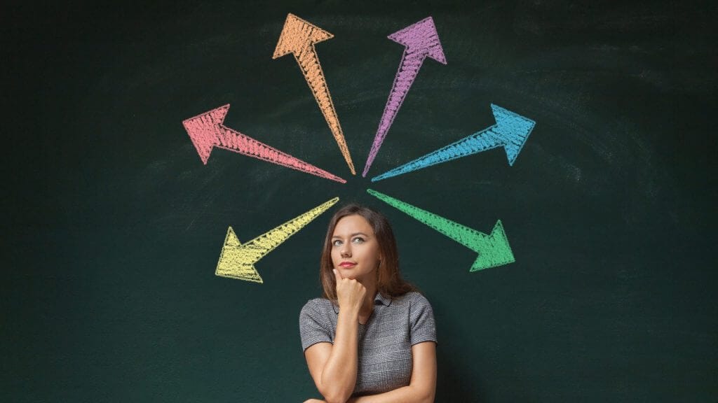 Woman thinking with coloured arrows pointing above her head